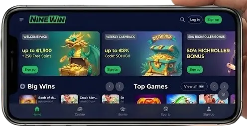 Hand holding smartphone displaying NineWin casino mobile app home screen.